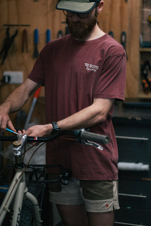 The Woods Cyclery Embroidered Logo T-Shirt - Stonewashed Burgundy