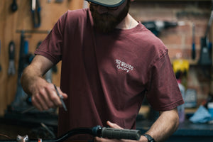 The Woods Cyclery Embroidered Logo T-Shirt - Stonewashed Burgundy